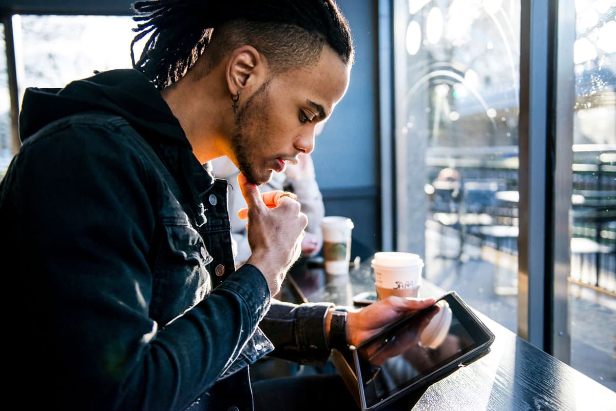 Business people using SmartWiFi in a cafe